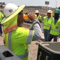 Department of Transportation workers in Arizona take a hydration break while doing road work