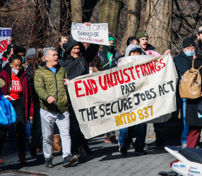 Multiracial group of workers march in support of Secure Job Act.