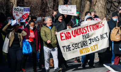 Multiracial group of workers marching in support of the Secure Jobs Act.